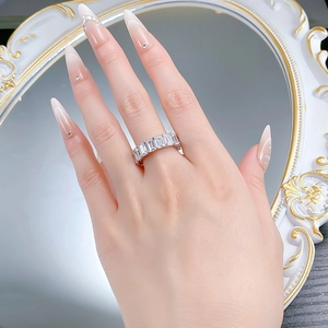 Model wearing stacked S925 silver eternity ring with emerald-cut cubic zirconia stones
