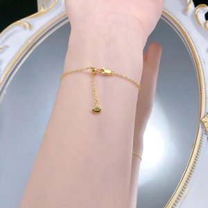 Detailed view of gold S925 silver bracelet with fan-shaped pendant and adjustable chain