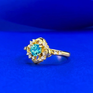 Bague en argent S925 avec pierre bleue ronde et pavé de diamants en serti fleur plaqué or