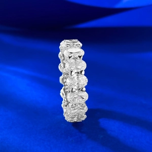Macro detail of S925 silver eternity ring with oval-cut cubic zirconia in full pavé setting