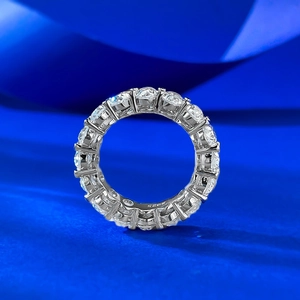 Detailed macro shot of S925 sterling silver eternity band with oval cut stones
