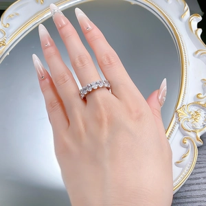 Close-up of elegant S925 silver eternity ring with oval-cut cubic zirconia gemstones