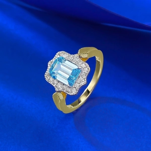 Elegant S925 sterling silver ring with emerald-cut blue topaz and gold finish