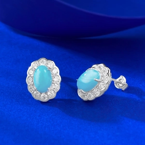 S925 silver stud earrings featuring oval blue larimar stone with white zircon halo