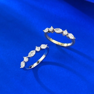 Elegant set of 925 sterling silver rings with marquise and round cut stones in gold and silver