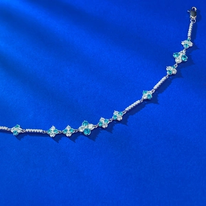 Elegant S925 silver bracelet with blue zircon clover charms and secure lobster clasp