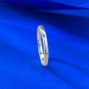 Macro detail of high-polished S925 sterling silver minimalist ring band with hallmark