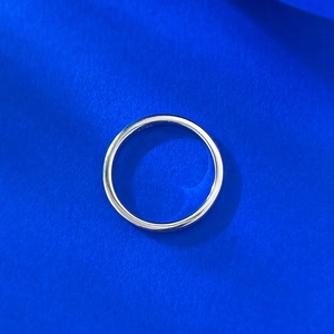 Detail view of S925 hallmark engraving on the smooth minimalist silver band ring