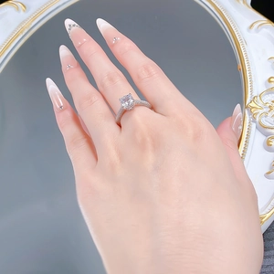 Close-up of S925 silver ring with 7x7 radiant cut stone and pavé setting on hand