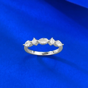 Detailed macro view of S925 sterling silver ring showing marquise-cut stones and hallmark