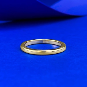 Macro shot of polished gold-plated 925 silver ring featuring S925 engraved logo