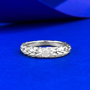 Faceted 925 sterling silver ring with 0.3ct moissanite on a vibrant blue background