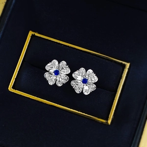 Sparkling S925 silver four-leaf clover stud earrings with blue and clear gemstones