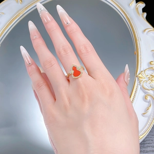Close-up of 925 silver red agate wulu ring with pave setting on a model hand