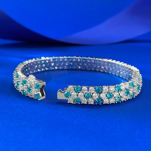 Close-up of a three-row S925 silver tennis bracelet with sea blue and white stones