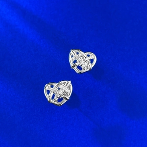 Detailed view of S925 silver heart stud earrings with hollow woven pattern and zircon stones