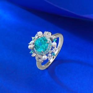 925 silver flower ring with blue paraiba stone, white pearls and sparkling zircons