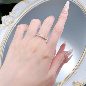Macro shot of 925 silver ring featuring marquise and round cut stones in a vintage style