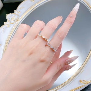 Close-up of elegant gold plated 925 silver rings with marquise cut zircon on a hand