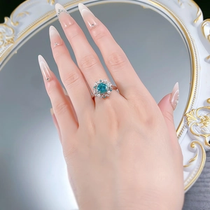 Macro detail of 925 silver ring with Paraiba blue gemstone, pearls and diamonds