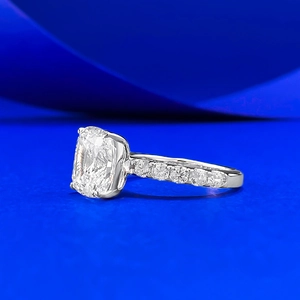 Classic cushion-cut S925 silver ring with sparkling side stones and a four-prong setting