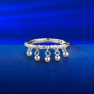 Minimalist S925 sterling silver ring with five dangling bell tassels on blue velvet