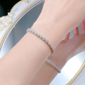 Close-up of S925 sterling silver snowflake bracelet with sparkling cubic zirconia on a wrist