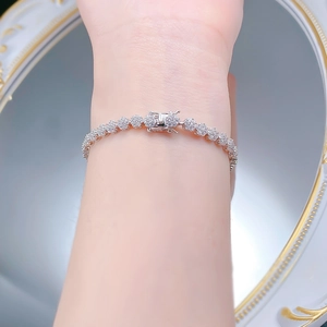 Macro shot of silver S925 snowflake bracelet with box clasp and micro-pave crystals
