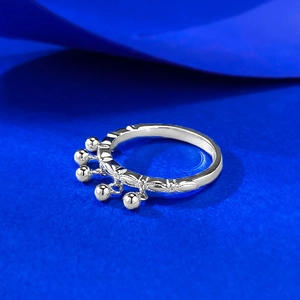 Detailed view of S925 silver ring featuring vintage carvings and five hanging bell charms
