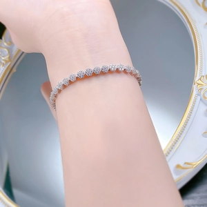 Close-up of S925 silver snowflake bracelet with cluster diamonds on woman wrist