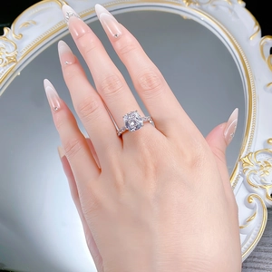 S925 silver cushion cut ring shown on hand with vintage gold mirror backdrop