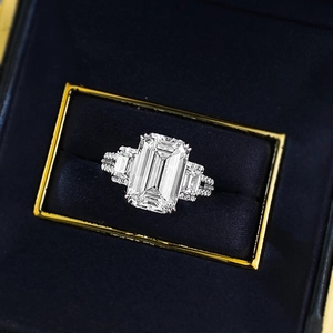 Classic S925 silver emerald cut rectangular white diamond ring in a black velvet jewelry box