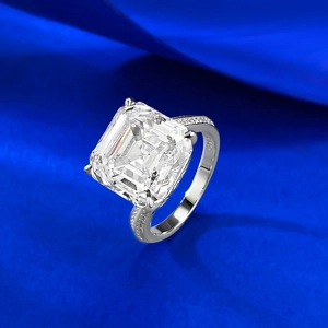 Elegant 925 sterling silver ring with square Asscher cut diamond on blue silk fabric