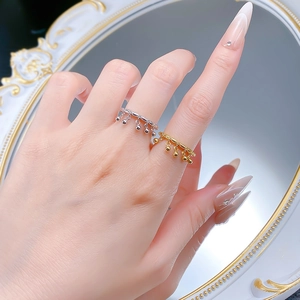 Elegant S925 silver bell tassel rings in gold and silver finish on model hand