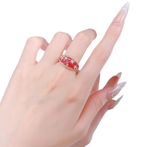 Luxurious gold ring with cluster of red rubies and micro-pave white zircons for women