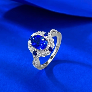Detail view of oval blue gemstone ring in S925 sterling silver with side hollow carving