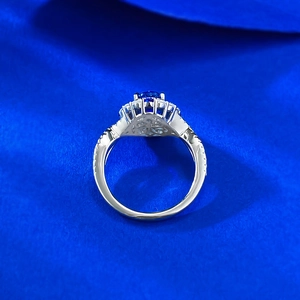 Elegant S925 silver ring featuring a large oval blue sapphire stone with halo diamonds