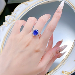 Classic S925 silver oval blue sapphire halo ring with floral cluster setting on finger