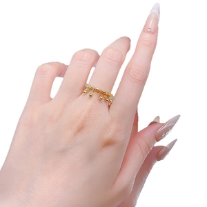 Minimalist S925 silver bell tassel ring in gold finish featuring moving metal bead charms