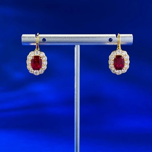 Elegant S925 silver stud earrings featuring 6x8mm ruby gemstones with diamond halo