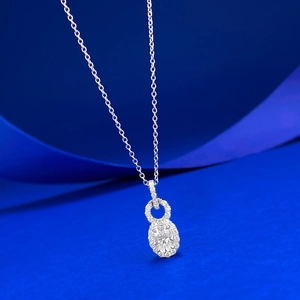 Elegant S925 silver necklace featuring an oval white diamond pendant on blue silk
