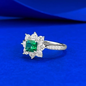 Classic S925 silver ring with rectangular emerald-cut green stone and flower halo