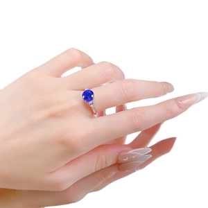 S925 silver ring with 8mm round blue spinel and side diamonds shown on hand