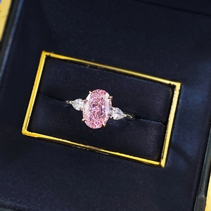 Classic S925 silver ring featuring a pink oval gemstone with side pear-cut stones