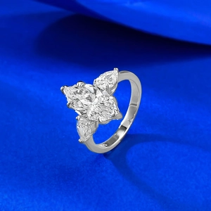 Luxurious S925 silver marquise-cut floral ring on deep blue silk background