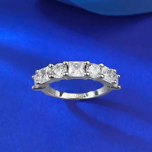 S925 sterling silver geometric pavé ring with sparkling clear stones on blue background