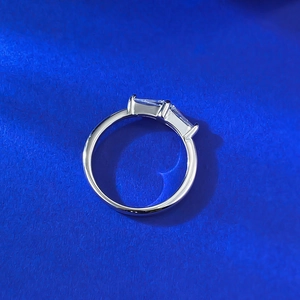 Modern silver ring with double baguette cut clear stones in a minimalist prong setting
