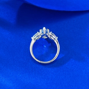 Detailed top view of 925 silver ring featuring 7x14 marquise-cut clear gemstone and side stones