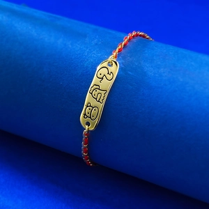 Macro view of S925 red rope bracelet with golden metal charms of zodiac animals