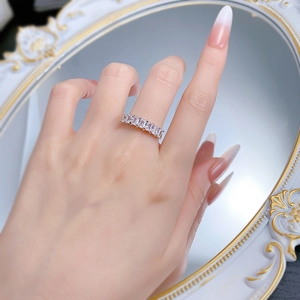 Detail of S925 sterling silver ring with rectangular baguette cut stones on hand
